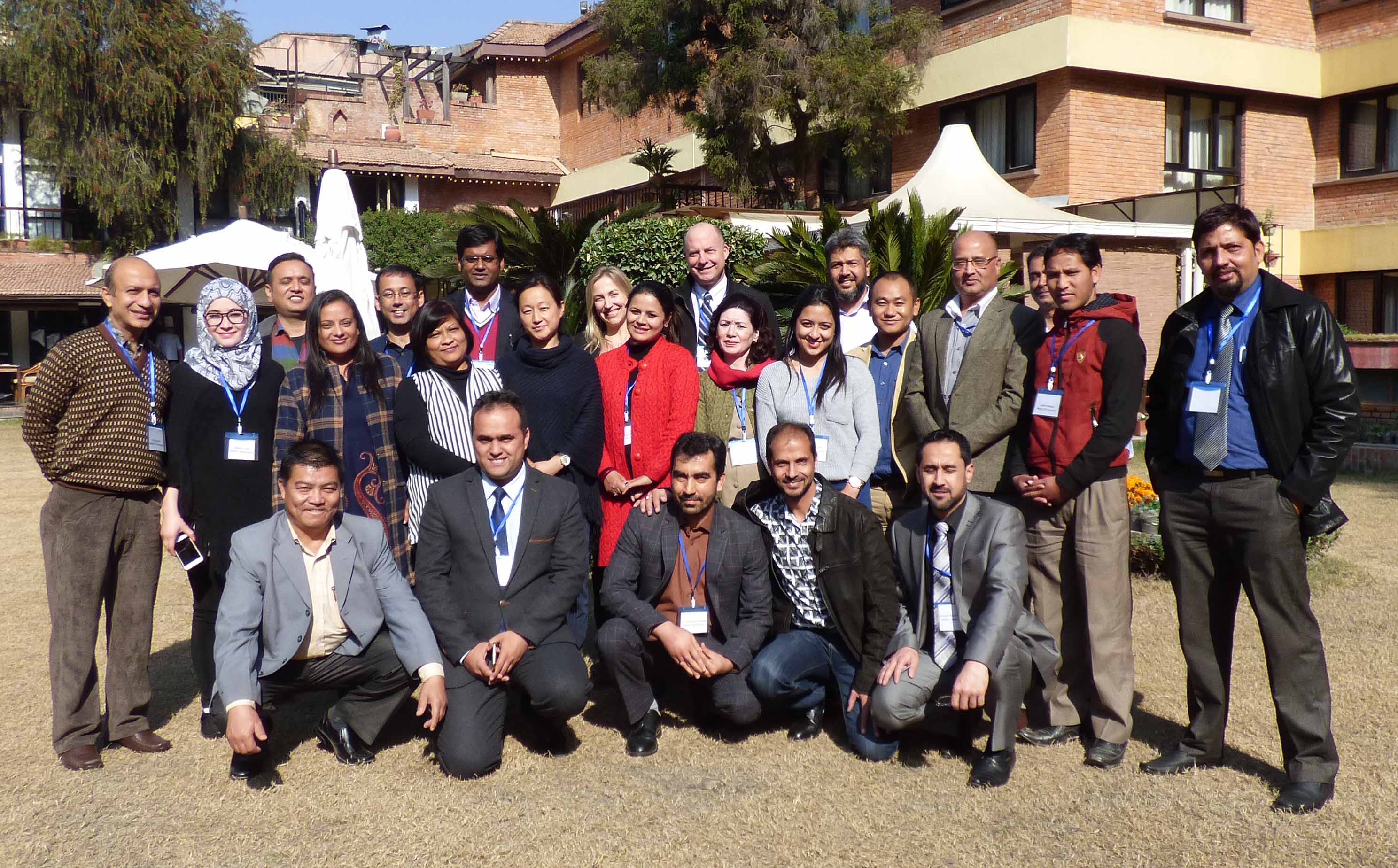 CRS and ASMO teams posing for a photo